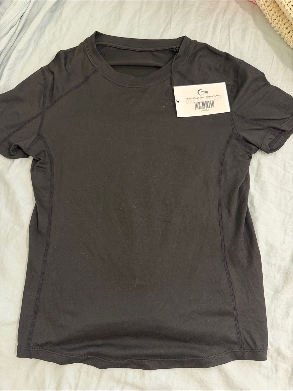 ZYIA Black Short Sleeve Performance Tee back tie